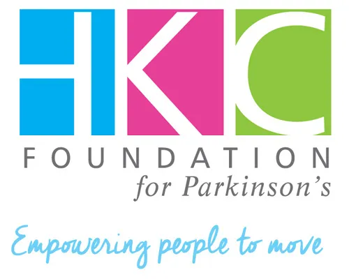 The logo for the HKC Foundation for Parkinson's. The logo has a blue background behind a white capital H, a magenta background behind a white capital K, and a pale green background behind a capital C. The logo reads "HKC Foundation for Parkinson's. Empowering people to move."